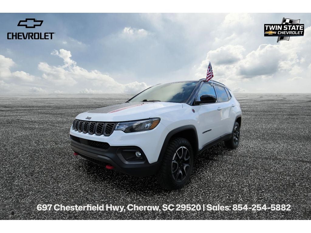 2025 Jeep Compass Trailhawk in White — front three-quarter view